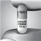 Hold the DEPAKOTE Sprinkle Capsule so that the end marked "This end up" is upright and the arrow on the capsule points up. The DEPAKOTE Sprinkle Capsule is extra-large to help prevent spilling the contents, but handle it carefully. 
